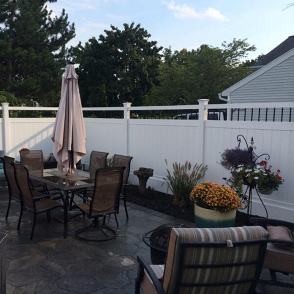 Florence white vinyl privacy fence on decorated patio