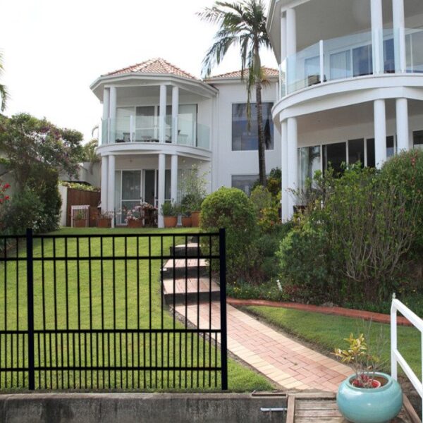 Terrier Aluminum Fence in front of 2 story balcony house